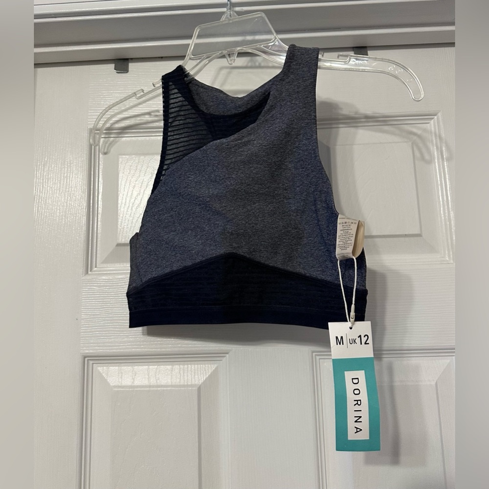 Dorina Be Remarkable Sports Bra is a size Medium.